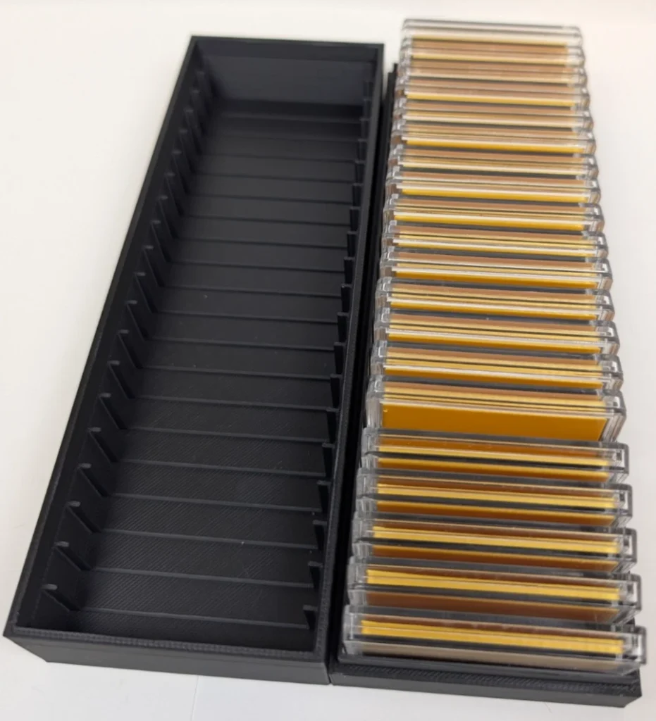 Black 20/40-slot holder shown open and closed with encapsulated silver bars.