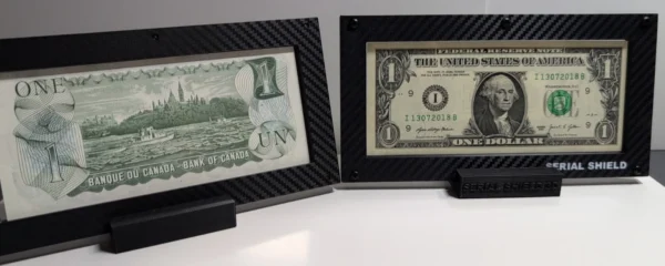 Angled front view of two budget currency frames positioned side by side