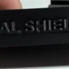 Close-up of the Serial Shield 3D™ branding on a budget currency-frame stand