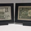 Angled front view of two premium currency frames positioned side by side