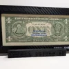 Close rear view of a premium currency frame with the back of a sample U.S. one-dollar note