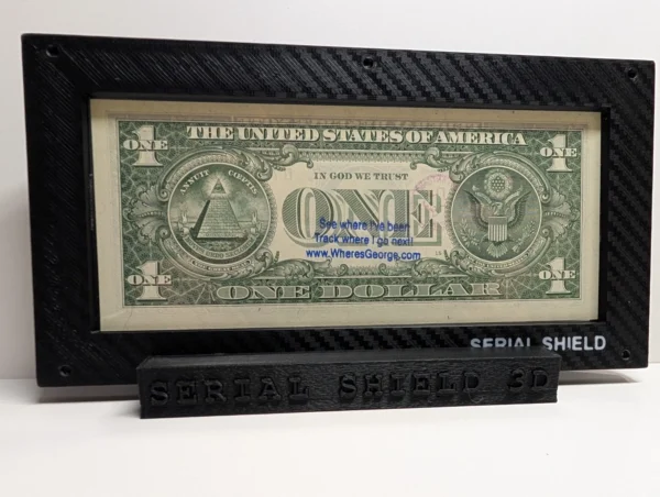 Close rear view of a premium currency frame with the back of a sample U.S. one-dollar note