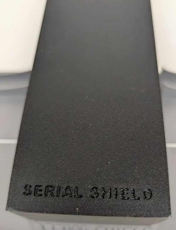 20-Slot 1 oz Bar Capsule Storage Box – Branded Lid Top | Serial Shield 3D™ Top view of the black lid with Serial Shield 3D™ branding