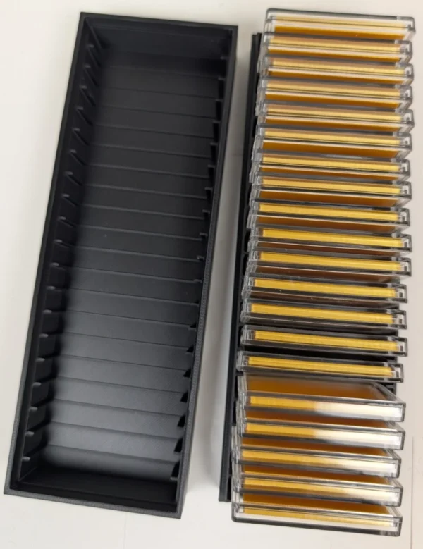 20-Slot 1 oz Bar Capsule Storage Box – Loaded Interior View | Serial Shield 3D™ Open storage box showing bar capsules arranged in the 20 individual slots