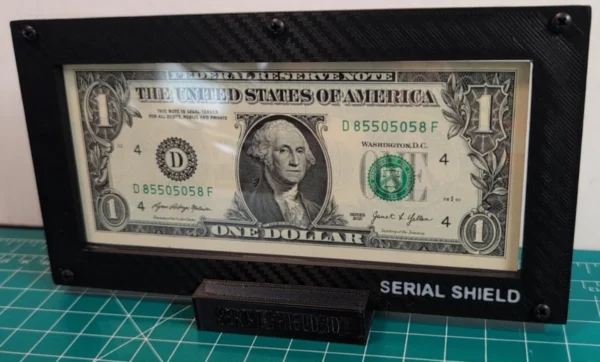 Budget 4-Mil Currency Display Frame with Stand – Front Display Close-Up | Serial Shield 3D™ Close front view of the framed one-dollar note seated in the black stand