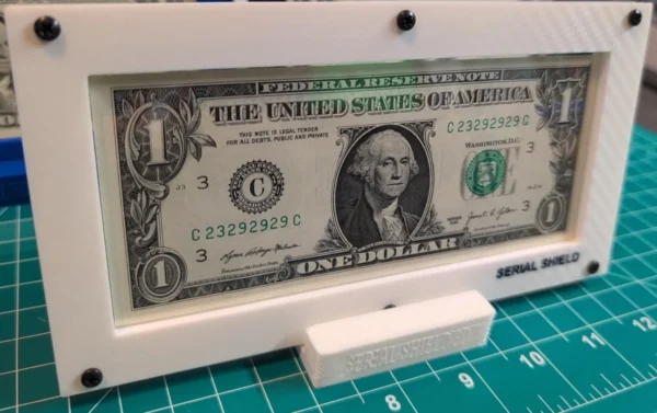 Budget 4-Mil Currency Display Frame with Stand – Framed Note Angled View | Serial Shield 3D™ Angled front view of the framed one-dollar note on its display stand