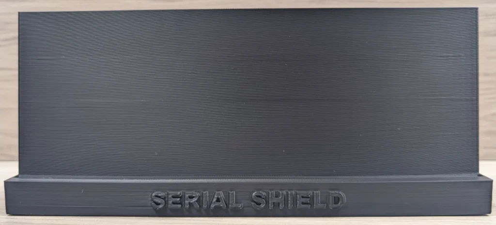 Front view of an empty black graded banknote display stand with Serial Shield 3D™ branding