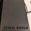 20-Slot 1 oz Coin Capsule Storage Box – Branded Lid Top | Serial Shield 3D™ Top view of the black carbon-fiber lid with Serial Shield 3D™ branding