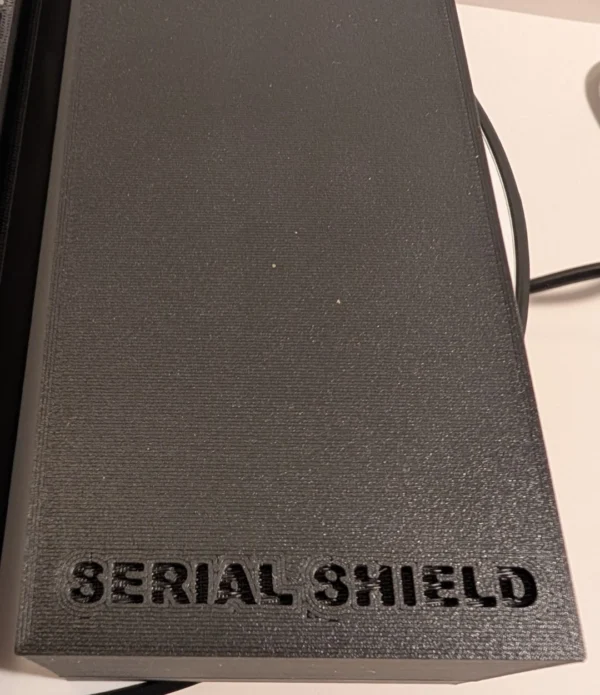 20-Slot 1 oz Coin Capsule Storage Box – Branded Lid Top | Serial Shield 3D™ Top view of the black carbon-fiber lid with Serial Shield 3D™ branding